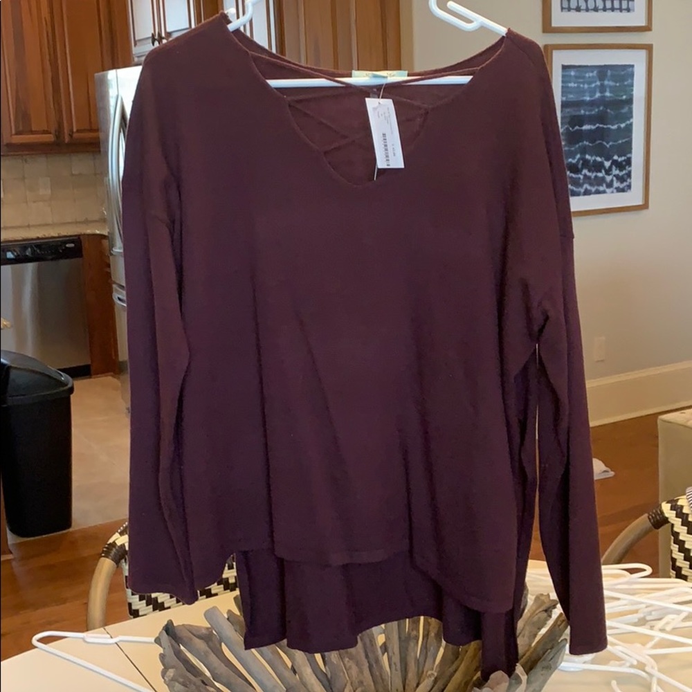 Shirts with tags still on.
